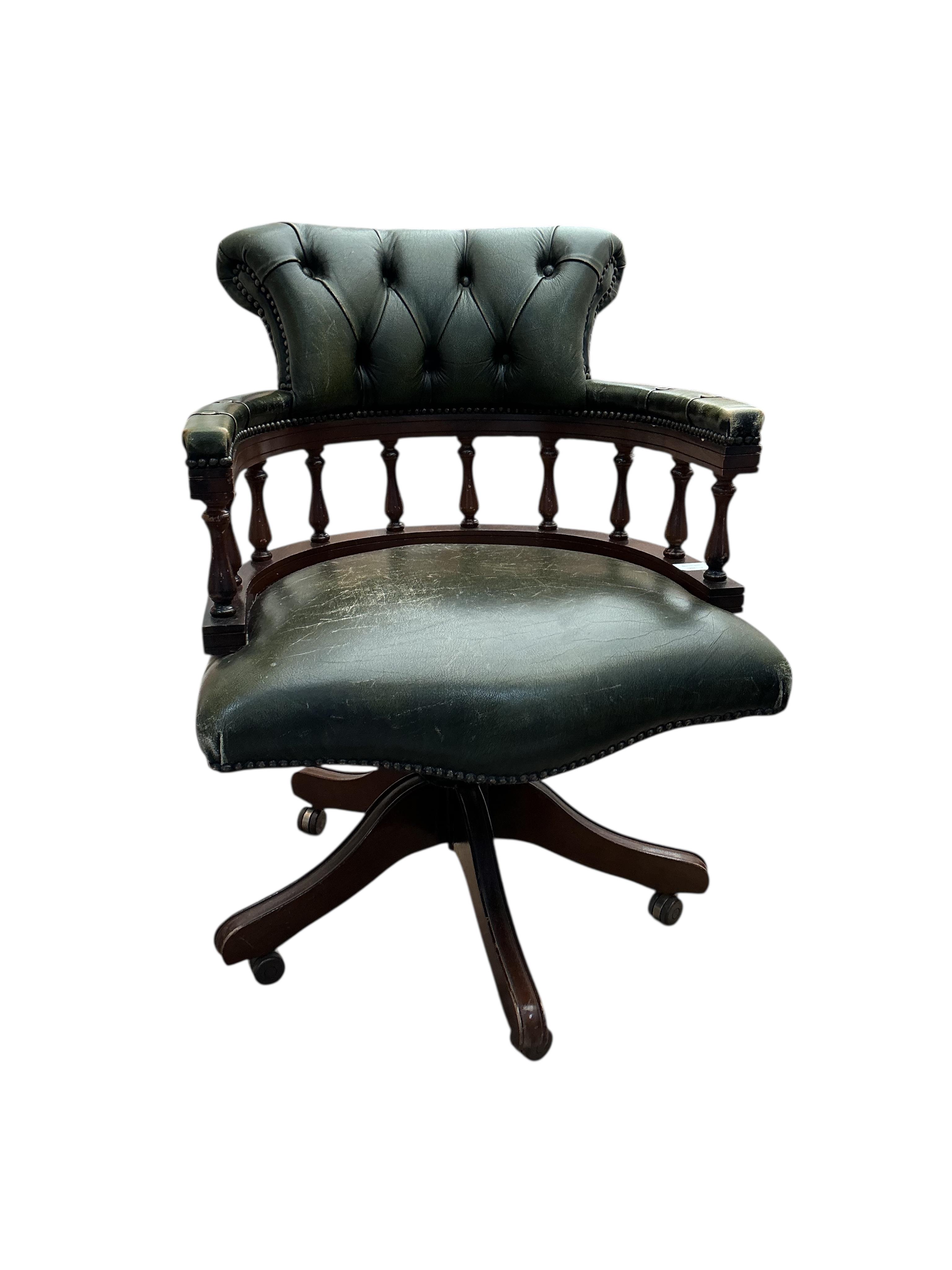 A reproduction buttoned green leather beech swivel desk chair, width 61cm, depth 54cm, height 88cm